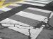 Utility Cut Photo of badly cracked painted street crossing area of a city roadway needing utilities cut off prior to repairs